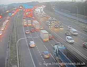 Traffic 'backing up' on M60 after crash causes lane closure
