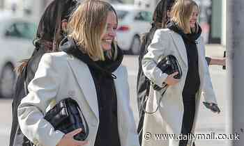 Heavily pregnant Lara Bingle covers up her baby bump as she joins Phoebe Tonkin for breakfast in LA