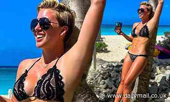 Savannah Chrisley poses in a black lace bikini as she enjoys Cayman Islands vacation