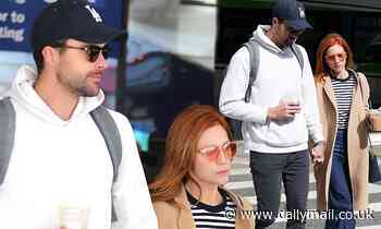 Brittany Snow holds hands with fiance Tyler Stanaland as they arrive at LAX