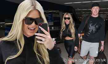 Kim Zolciak looks trim as she arrives in LA with husband Kroy Biermann and daughter Brielle