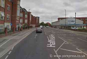 Burst water pipe repaired on York road - temporary lights still in place