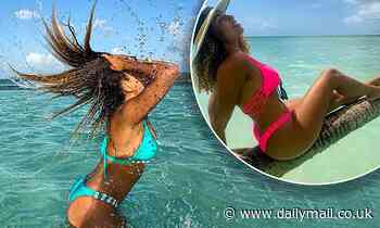 Love Island's Amber Gill shows off her playful side in a turquoise bikini in the Caribbean