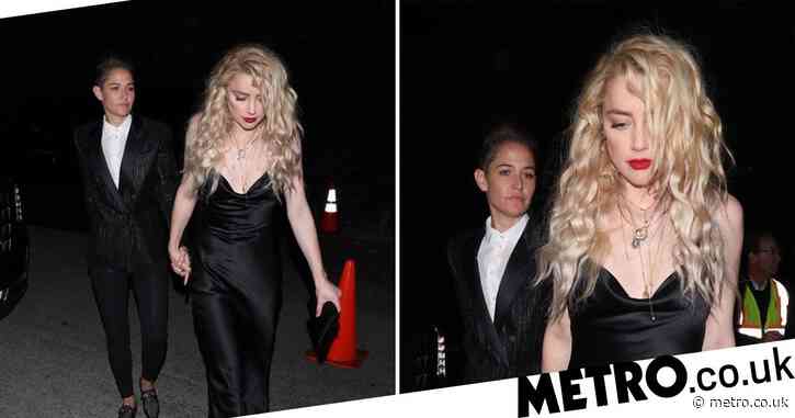 Amber Heard keeps head down as she heads to Pre-Oscars party with new girlfriend