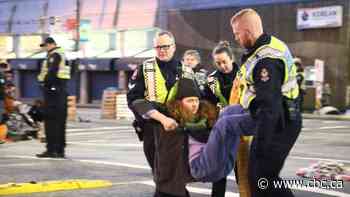 Police arrest 34 anti-pipeline protesters at Vancouver port as they enforce court injunction