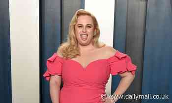 Rebel Wilson flaunts her slimmed down waist at Oscars party following epic weight loss