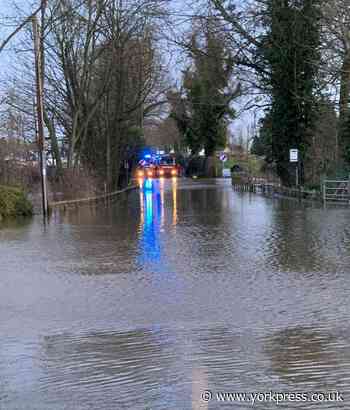 Car gets stuck in flood water in village near York