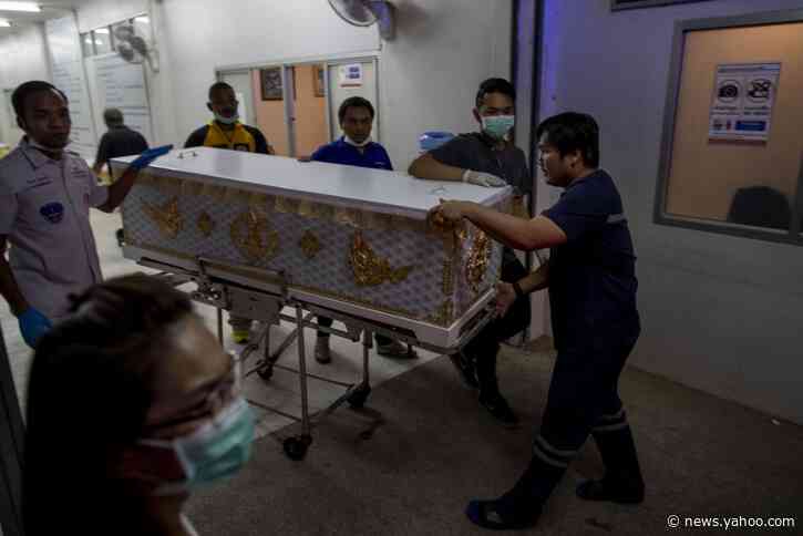 Families of Thai shooting victims wait for answers, bodies