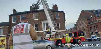 Fire fighters in York city centre roof top drama