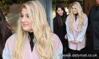 Meghan Trainor looks radiant in a blush pink and grey coat as she steps out in London