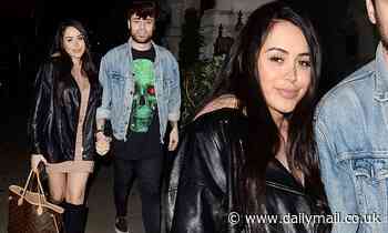 Marnie Simpson cuts an edgy figure in an oversized leather jacket as she enjoys a date night