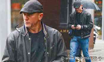 Daniel Craig looks casually cool in a baseball jacket and flat cap