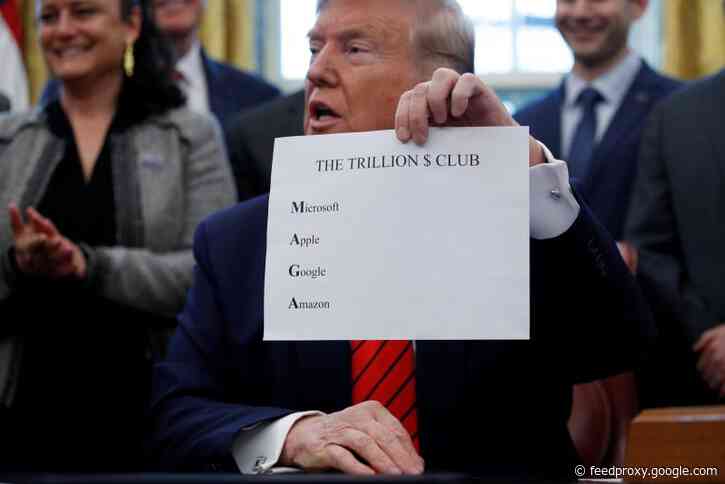 Trump made a special sign to show reporters that the initials of the 4 most valuable stocks spell MAGA