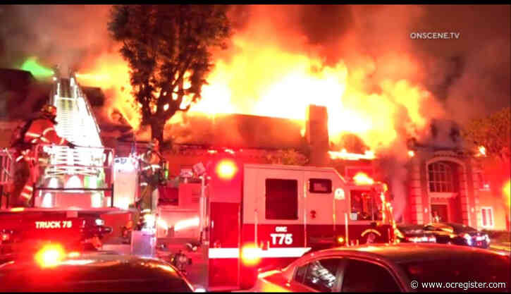 Fire tears through Tustin apartment complex, injuring 2 and displacing 100