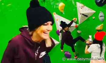 Caroline Flack looks relaxed and care-free as the giggling star goes wall climbing with a friend