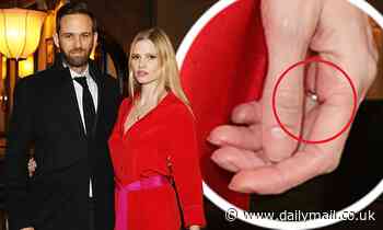 Lara Stone spotted wearing a ring as she cosies up to beau David Grievson amid engagement rumours