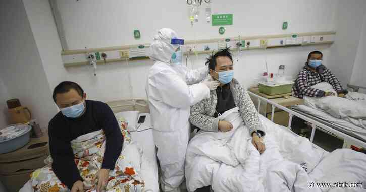 China reports spike in virus cases with new way of counting