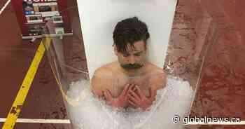 Edmonton firefighter unofficially breaks world record in ice coffin during muscular dystrophy campout - Global News