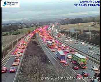 Vehicle stuck under barrier on Thelwall Viaduct following crash