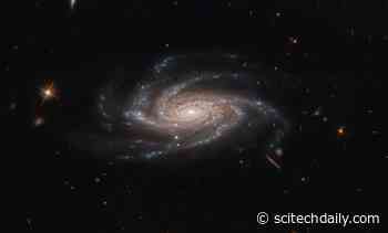 Hubble Space Telescope Spots Ghostly Spiral With Open Arms