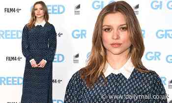 Sophie Cookson cuts an elegant figure in blue floral dress and white shirt