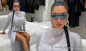 Kim Kardashian strikes a pose in her cavernous closet