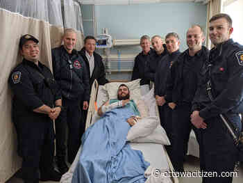 Firefighters reunite with man they painstakingly freed following spectacular crash
