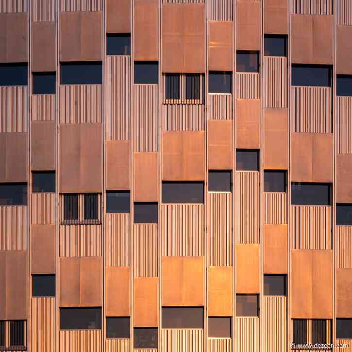 Lundgaard & Tranberg clads cylindrical school in perforated metal