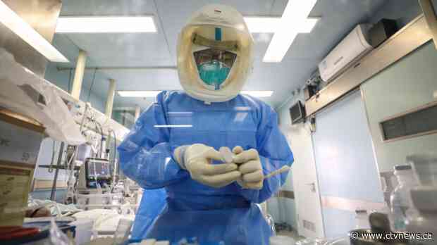 China sees big drop in new virus cases
