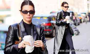Kendall Jenner flashes glimpse of toned torso as she works Matrix-inspired black coat