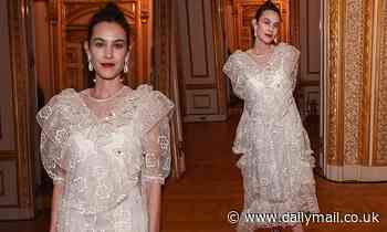 Alexa Chung looks effortlessly elegant in a feminine white dress