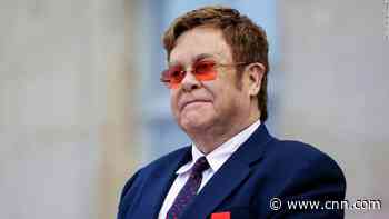 Elton John had to stop a performance due to walking pneumonia. What is it?