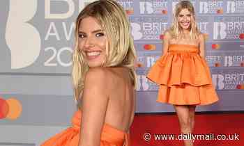 BRITs 2020: Mollie King serves up beachy boho glamour in a kooky ruffled tangerine mini-dress