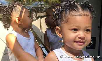 Kylie Jenner puts large J-Lo type hoop earrings on her daughter Stormi, two
