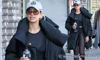 Dua Lipa nails casual chic in sheer black crop top and matching leggings