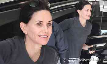 Courteney Cox looks youthful and energized as she smiles on her way to a gym workout session in LA