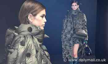 Kaia Gerber cuts a quirky figure in a green spiked coat for Moncler's Milan Fashion Week show 