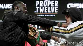 Pushing and shoving as Wilder-Fury collide