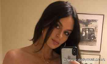 Pregnant Nicole Trunfio poses for a selfie and includes her urine sample in the frame