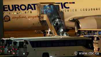 Flight carrying Canadian cruise passengers who tested negative for coronavirus on way home