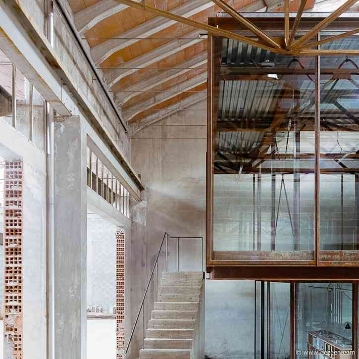 AMAA creates own studio by inserting huge glass box inside old Italian factory