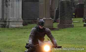 Batman sighted in Scotland: Caped crusader tears through a Glasgow cemetery on a motorbike