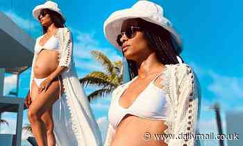 Ciara dares to bare her baby bump in a white bikini while on tropical babymoon with Russell Wilson
