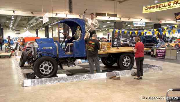Restored vintage truck among hot rods at World of Wheels