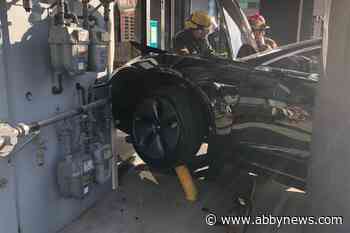 Brand new Tesla crashes into Surrey store front, mounts gas line