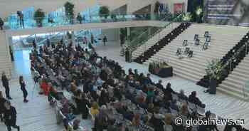 Edmontonians gather at city hall to honour Flight 752 crash victims with condolence book