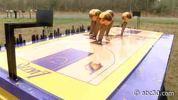 Kobe Bryant custom made tribute casket features 5 replica NBA Finals trophies