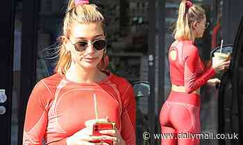 Hailey Bieber displays her incredible abs in a red crop top after a sweat session in LA