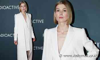 Rosamund Pike wore a structured white gown as she walked the red carpet for Radioactive's premiere