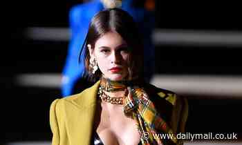Kaia Gerber puts on a VERY busty display as she storms the runway for Yves Saint Laurent show at PFW